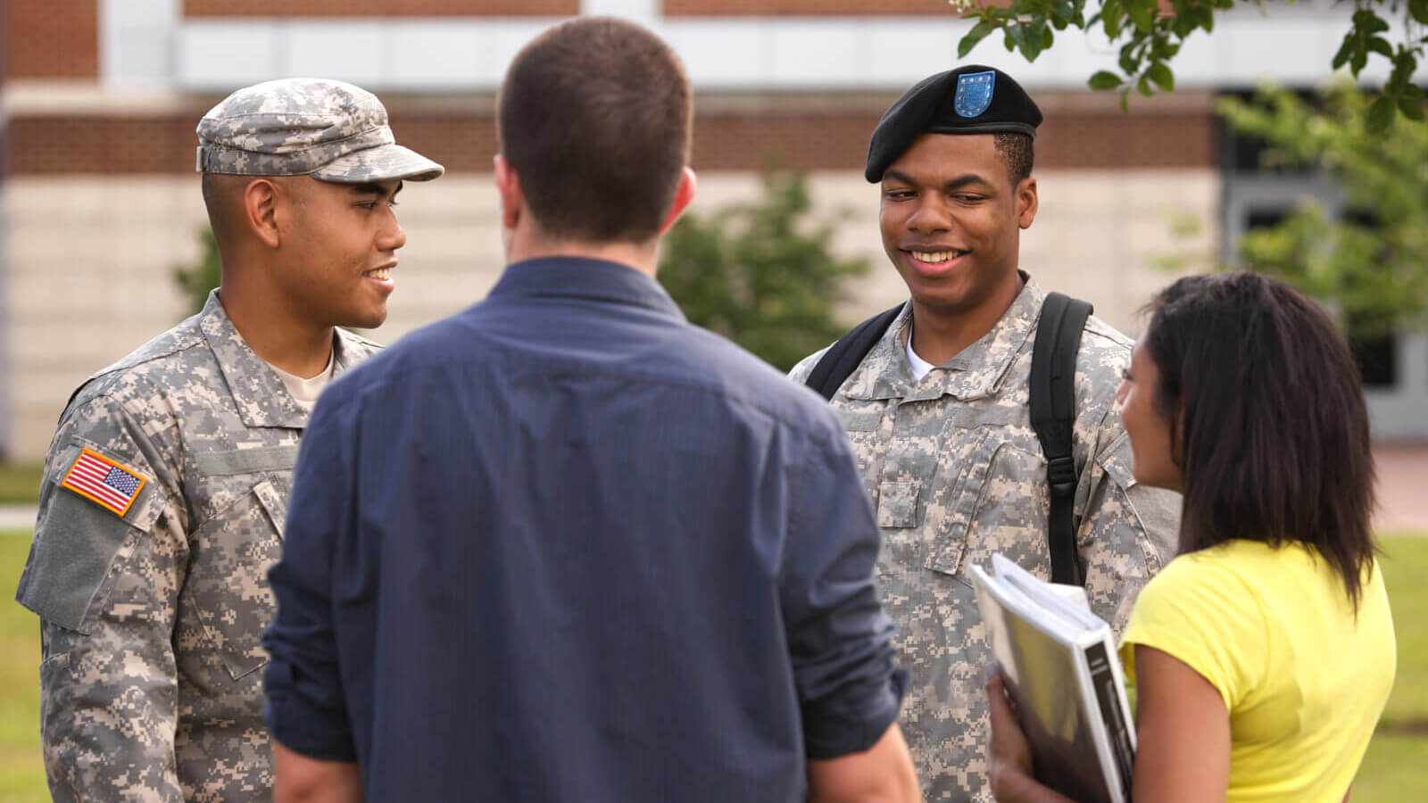college students talk to ROTC members